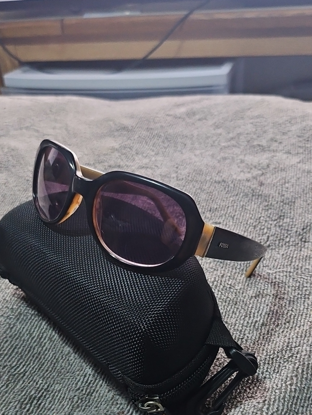 Fossil Women's Black Frame Sunglasses with Gold Temples and Purple Lenses